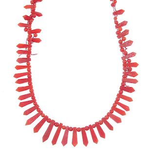 <p>Two coral necklaces and a pair of coral ear studs. The coral studs of bouton shape with star shap
