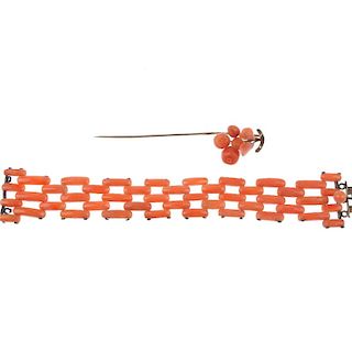 <p>A selection of coral pieces. To include a floral carved coral stickpin and a bracelet with coral