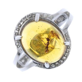 A natural Burmese amber ring with mosquito and ant inclusions. The natural Burmese amber cabochon me