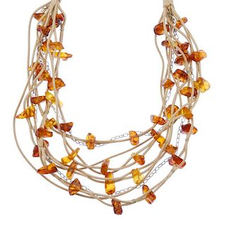 Two rough amber and cord necklaces and two rough amber and cord necklaces with matching bracelets. E