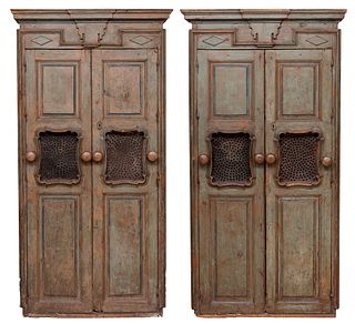 Pair of cabinets; Spain, early 18th century.
Polychrome carved wood with antique iron fittings.