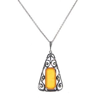 <p>A selection of amber and plastic jewellery. To include two plastic pendants in the form of clogs,