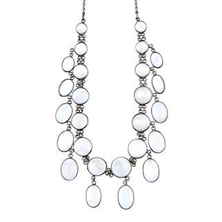 A moonstone necklace. Designed as a graduated line of circular moonstone cabochons suspending furthe