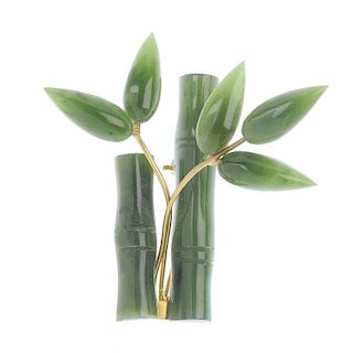 A nephrite jade brooch. In the form of two bamboo canes, with two metal branches, each with nephrite