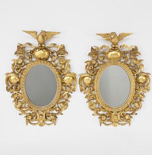 Pair of American Carved Giltwood Oval Mirrors, 19th Century
