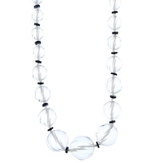 A rock crystal necklace and matching earrings. The necklace designed as graduated spherical spiral d