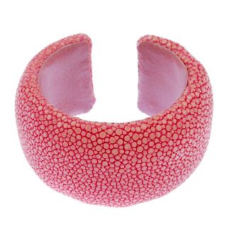 A dyed pink stingray cuff. Signed Maximos. Inner diameter 5.5cms. Width 4cms. <br><br>Overall condit