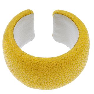 A dyed yellow stingray cuff. Signed Maximos. Inner diameter 5.3cms. Width 4cms. <br><br>Overall cond