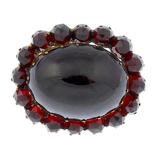 A gem necklace, a paste necklace and a garnet and paste brooch. The oval-shape cabochon garnet with