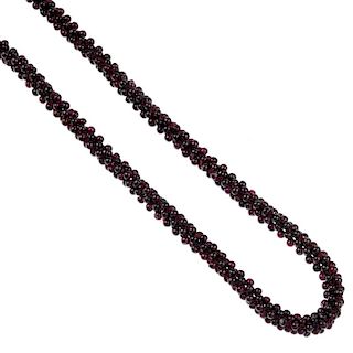 A selection of gem jewellery. To include a garnet necklace, designed as a series of woven beads, a f
