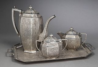 Silver coffee set; Kashmir, India, ca. 1920.
Coffee pot, creamer/milk jug, sugar bowl and tray.
Slight wear marks.