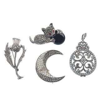 A selection of marcasite jewellery. To include two dog brooches, a cat brooch, a thistle brooch and