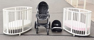 Three Piece Lot to include two Stokke cribs in white paint, along with a Cityselect stroller. 