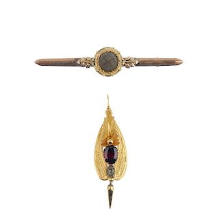 A gold pendant and brooch. The first, a mid 19th century pendant, of foliate design, with an oval-sh