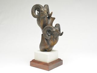 Pair of bronze big horn sheep busts on marble and hardwood base, Gerald Balciar.