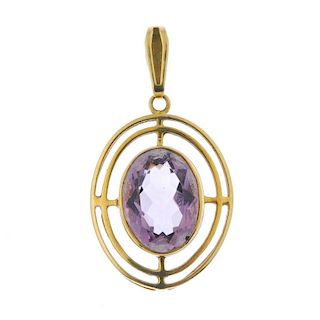 <p>A 9ct gold amethyst pendant. The oval-shape amethyst, within an openwork surround, to the similar