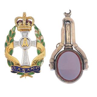 A selection of gold jewellery. To include a 9ct gold and enamel Queen Alexandra's Royal Army Nursing