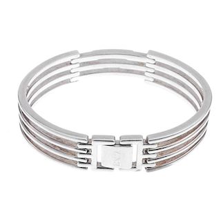 EMPORIO ARMANI - a bracelet and a ring. The ring designed as a tapered band to the central revolving