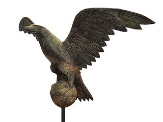 Large and impressive full body copper weathervane of eagle mounted on globe, last quarter 19th century.