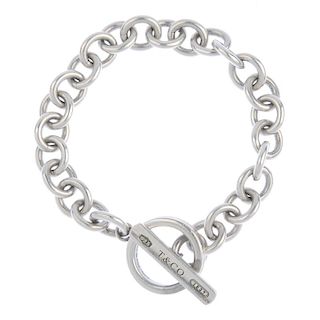 TIFFANY & CO. - an '1837' bracelet. The chain-link bracelet fastening with a t-bar of concave ring a