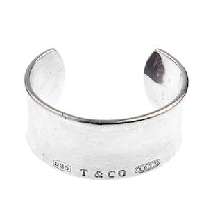 TIFFANY & CO. - an '1837' bangle. The concave cuff with 'T & Co. 1837' to the front. Signed 2001 Tif