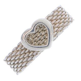 TIFFANY & CO. - a dress ring. Designed as a band of woven mesh, with heart highlight. Signed T & Co.