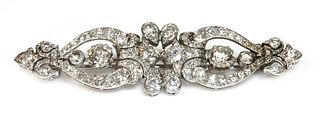 A diamond set bar brooch,