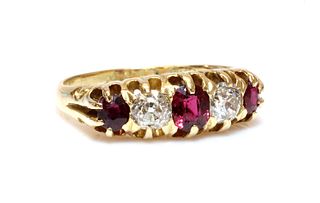 An 18ct gold red spinel, ruby and diamond boat shaped ring, c.1900,