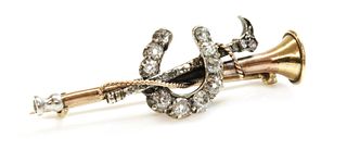 A cased diamond set hunting horn, horseshoe and crop bar brooch, c.1900,