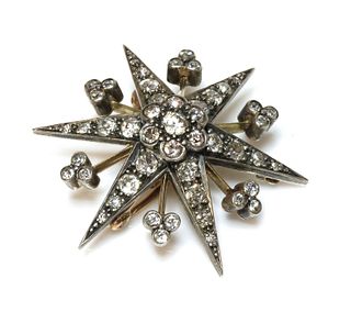 A late Victorian diamond set star brooch/pendant, c.1890,