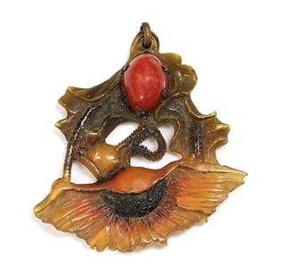 A French Art Nouveau carved horn pendant, by George Pierre, c.1910,