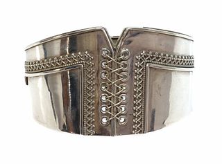 A Victorian sterling silver hinged bangle of corset form,