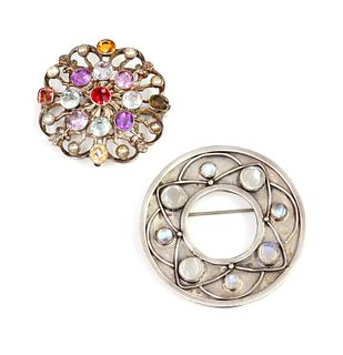 A silver Arts & Crafts moonstone circle brooch,