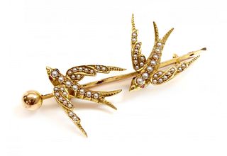 A gold and split pearl swallow brooch, c.1900,