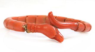 A late Victorian carved coral graduated snake bracelet, or semi flexible bangle,