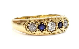 A gold five stone diamond and sapphire ring,