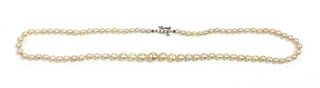 A single row graduated natural saltwater pearl necklace,