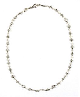 A platinum diamond and seed pearl necklace,