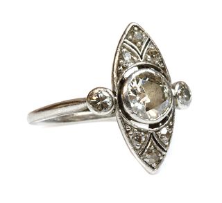 An Art Deco platinum marquise shaped diamond set ring,