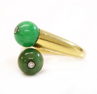 A two stone jade bead and diamond crossover ring, by Cartier,