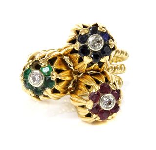 A set of three diamond and gem set stacking rings, c.1950,