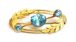 A gold blue zircon oval wreath brooch, by Payton Pepper, c.1950,