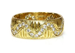 An 18ct gold diamond set band ring, c.1970,