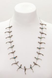A silver Navajo bird necklace,
