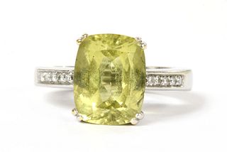 A gold heliodor and diamond ring,