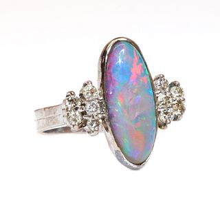 A white gold opal doublet and diamond ring,