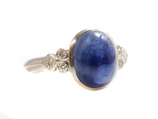A single stone cabochon sapphire ring,