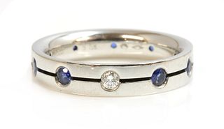 A Swiss platinum diamond and sapphire set band ring, by Furrer-Jacot,