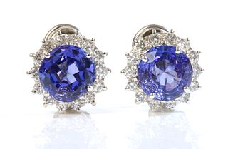 A pair of 18ct white gold tanzanite and diamond cluster earrings,
