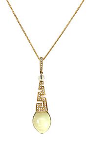 A gold citrine and diamond pendant,